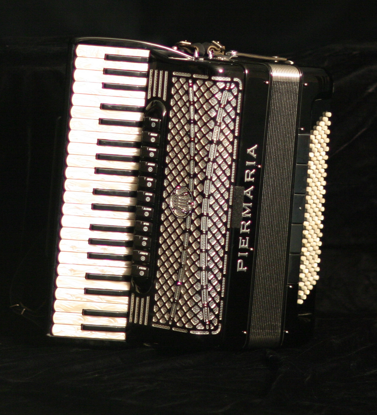 Yosifah plays accordion as well as qanun with Al 'Azifoon